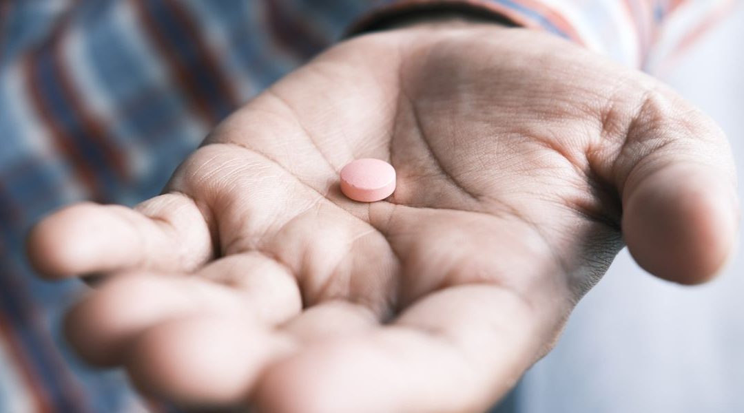 single pill in hand