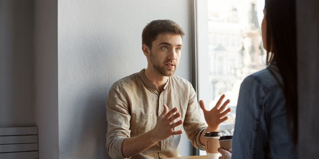 two people have a serious conversation