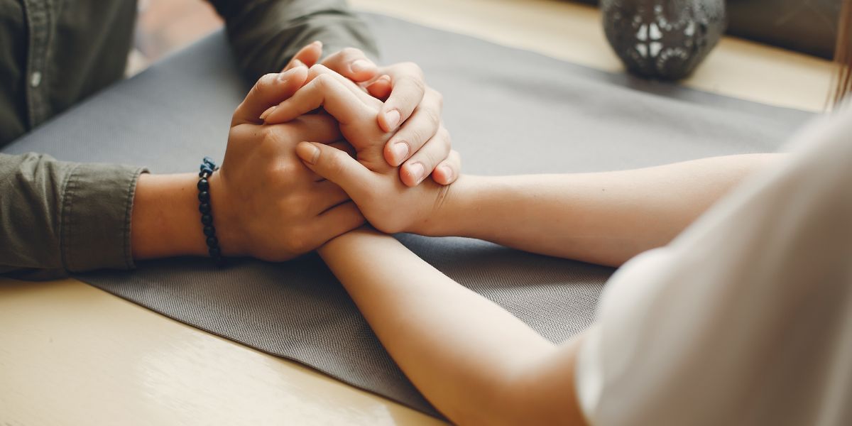 Couple holding hands